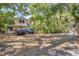 Backyard featuring lush trees and parking at 2315 Mcclellan Pkwy, Sarasota, FL 34239