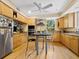 Eat-in kitchen features ample counter space, wood cabinets and stainless appliances at 2315 Mcclellan Pkwy, Sarasota, FL 34239