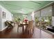 Bright sunroom with terra cotta tile, windows and decorative ceiling at 2315 Mcclellan Pkwy, Sarasota, FL 34239