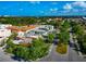 Picturesque aerial shot of neighborhood streetscapes with mature trees lining the roads, offering a tranquil living environment at 236 Harbor S Dr # 205, Venice, FL 34285