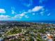 Wide aerial view of the city, showcasing residential homes, lush greenery, and a stunning ocean backdrop at 236 Harbor S Dr # 205, Venice, FL 34285
