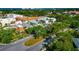 Bird's-eye view capturing the community's charm with tree-lined streets and diverse housing options near the coast at 236 Harbor S Dr # 205, Venice, FL 34285