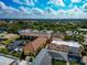 Beautiful aerial showcasing the neighborhood's proximity to the city and lush greenery with amazing sky for the entire view at 236 Harbor S Dr # 205, Venice, FL 34285