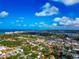 Stunning aerial view capturing the city, waterfront, houses, trees, and waterfront scenery at 236 Harbor S Dr # 205, Venice, FL 34285