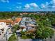 High-angle view displaying neighborhood homes with a mix of architectural styles, surrounded by verdant landscape and city views at 236 Harbor S Dr # 205, Venice, FL 34285