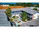 Charming courtyard featuring lush landscaping, garden, outdoor seating, and well-maintained surroundings at 236 Harbor S Dr # 205, Venice, FL 34285
