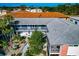 Beautiful courtyard featuring lush landscaping, a garden, and well-maintained stairs at 236 Harbor S Dr # 205, Venice, FL 34285