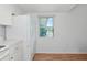Eat-in kitchen with window offering natural light and white refrigerator at 236 Harbor S Dr # 205, Venice, FL 34285