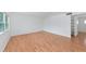 Light-filled living room with hardwood floors and an entry to closet space at 236 Harbor S Dr # 205, Venice, FL 34285