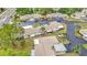 Scenic aerial view of villas showcasing lush landscaping, palm trees, and well-maintained exteriors in a charming community at 2802 Swifton Dr # V102, Sarasota, FL 34231