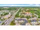 Aerial view of a villa community with beautiful trees, manicured landscaping, and convenient access to nearby roadways at 2802 Swifton Dr # V102, Sarasota, FL 34231