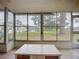 Enclosed patio with large windows offering views of the backyard at 2802 Swifton Dr # V102, Sarasota, FL 34231