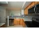 Bright kitchen featuring granite countertops, stainless steel appliances, and tile flooring at 3015 Chianti Ct # 104, Sarasota, FL 34237
