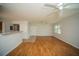 Open floor plan featuring wood flooring and views of the kitchen and entrance at 3015 Chianti Ct # 104, Sarasota, FL 34237