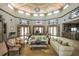 Luxurious lobby showcasing high ceilings, elegant sofas, tasteful décor, and a grand chandelier at 3015 Chianti Ct # 104, Sarasota, FL 34237