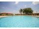 Resort-style pool with lounge chairs and lush landscaping, perfect for relaxing and enjoying the Florida sunshine at 3015 Chianti Ct # 104, Sarasota, FL 34237