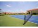 Well-maintained community tennis court with a clear view of surrounding buildings on a sunny day at 3015 Chianti Ct # 104, Sarasota, FL 34237