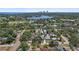 Scenic aerial view of a home with lush trees, a nearby golf course, and a picturesque waterway backdrop at 322 35Th Ne Ave, St Petersburg, FL 33704
