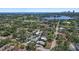 Expansive aerial view of a property surrounded by lush greenery, a golf course, and a waterway at 322 35Th Ne Ave, St Petersburg, FL 33704