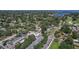 Aerial view of the home with golf course and waterfront views, lush green trees, and the surrounding neighborhood at 322 35Th Ne Ave, St Petersburg, FL 33704