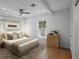Bedroom with hardwood floors, ceiling fan, recessed lighting, and large windows for natural light at 322 35Th Ne Ave, St Petersburg, FL 33704