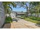 Home with a large driveway and mature trees at 322 35Th Ne Ave, St Petersburg, FL 33704