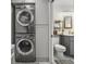 Convenient laundry area with modern washer and dryer units next to bathroom at 322 35Th Ne Ave, St Petersburg, FL 33704