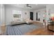 Inviting living area with hardwood floors, a comfortable sofa, and ample natural light at 322 35Th Ne Ave, St Petersburg, FL 33704