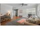 Bright living room featuring stylish furnishings, hardwood floors, and a view into the dining area at 322 35Th Ne Ave, St Petersburg, FL 33704