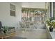Sunroom dining area with backyard views; a peaceful place to enjoy a meal at 322 35Th Ne Ave, St Petersburg, FL 33704