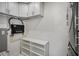 Organized utility room with tankless water heater and shelving at 322 35Th Ne Ave, St Petersburg, FL 33704