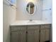 Bathroom with a classic sink, vanity, and oval mirror at 3221 Sweet Bay Ter, Sarasota, FL 34237