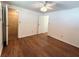 Spacious bedroom showcasing a laminate floor and a convenient closet space at 3221 Sweet Bay Ter, Sarasota, FL 34237