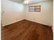 Bright bedroom with wooden floors, a ceiling fan, and ample natural light from a window at 3221 Sweet Bay Ter, Sarasota, FL 34237