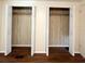 Bedroom closets featuring a wooden floor and a wooden wall design at 3221 Sweet Bay Ter, Sarasota, FL 34237