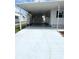 Spacious covered driveway perfect for parking and protection from the elements at 3221 Sweet Bay Ter, Sarasota, FL 34237
