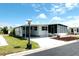 Charming home with a covered driveway and screened porch area at 3221 Sweet Bay Ter, Sarasota, FL 34237