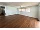 Bright living room with wood floors and nice window lighting at 3221 Sweet Bay Ter, Sarasota, FL 34237