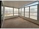 Enclosed patio featuring large windows providing lots of natural light and neutral carpeting at 3221 Sweet Bay Ter, Sarasota, FL 34237
