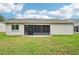 View of the backyard showcasing a patio and a well-maintained lawn at 338 Indian Key Way # 111, Englewood, FL 34223