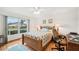 Bedroom featuring a large window with natural light and a ceiling fan at 338 Indian Key Way # 111, Englewood, FL 34223