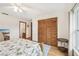 Bedroom showcasing a spacious closet, ensuite bathroom and a large window at 338 Indian Key Way # 111, Englewood, FL 34223