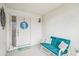 Cozy front porch with seating, decorative wreath and a welcoming mat at 338 Indian Key Way # 111, Englewood, FL 34223