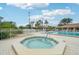 Inviting community hot tub beside the pool area, offering a relaxing spot with a view at 338 Indian Key Way # 111, Englewood, FL 34223