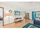 Open-concept living area with hardwood floors and access to a cozy, enclosed patio at 338 Indian Key Way # 111, Englewood, FL 34223