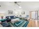 Bright living room with vaulted ceiling, ceiling fan, and comfortable seating at 338 Indian Key Way # 111, Englewood, FL 34223