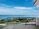 Enjoy spectacular ocean views from this beautiful balcony with glass railings, overlooking lush tropical foliage at 340 Gulf Of Mexico Dr # 124, Longboat Key, FL 34228
