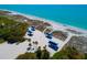 Beautiful beachfront featuring a sandy beach with picnic pavilions and clear blue ocean waters at 340 Gulf Of Mexico Dr # 124, Longboat Key, FL 34228