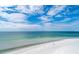 Scenic beachfront featuring the white sand beach and clear, shallow ocean water at 340 Gulf Of Mexico Dr # 124, Longboat Key, FL 34228