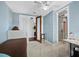 Comfortable bedroom with blue walls and adjacent bathroom at 340 Gulf Of Mexico Dr # 124, Longboat Key, FL 34228